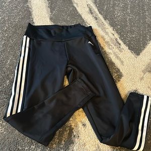 Adidas black leggings with white stripes. Large